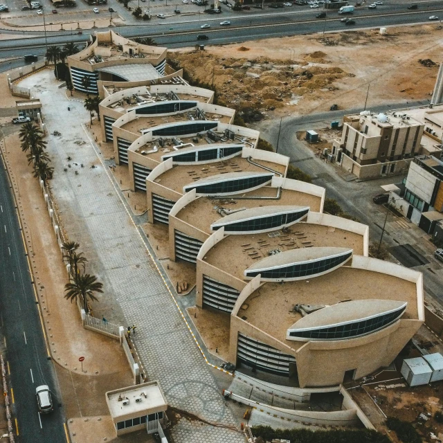 an aerial view of a parking lot near a freeway