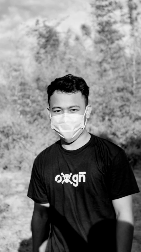 boy wearing mask on the street with rocky background