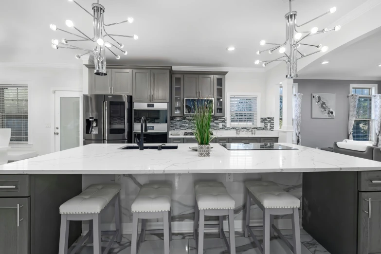 a kitchen with a large center island with stools