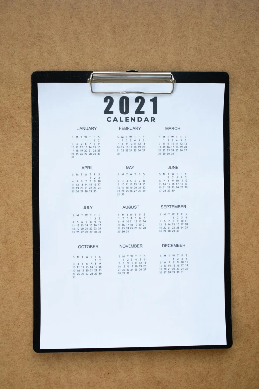 a 2011 calendar on a bulletin board pinned to a bulletin