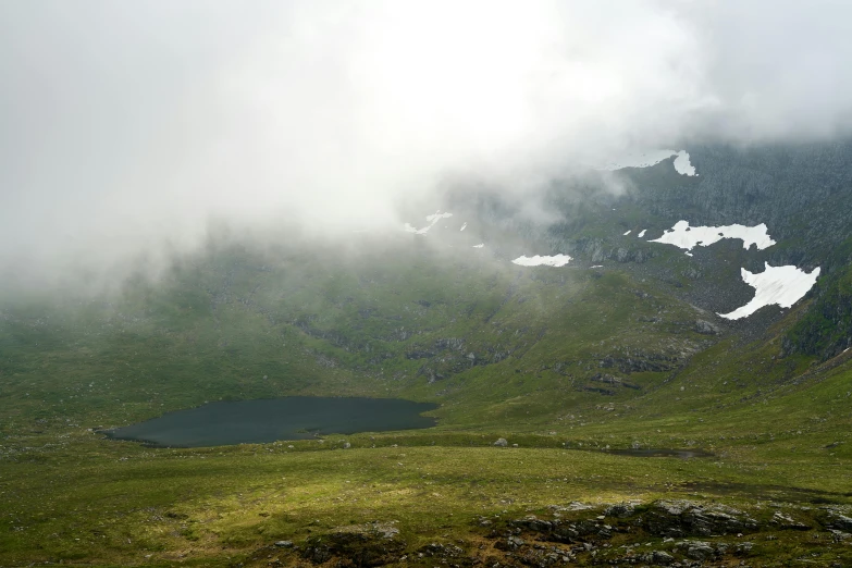 there are clouds hanging over the mountain on this day