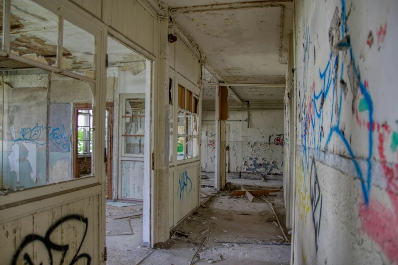the inside of an abandoned building covered in graffiti