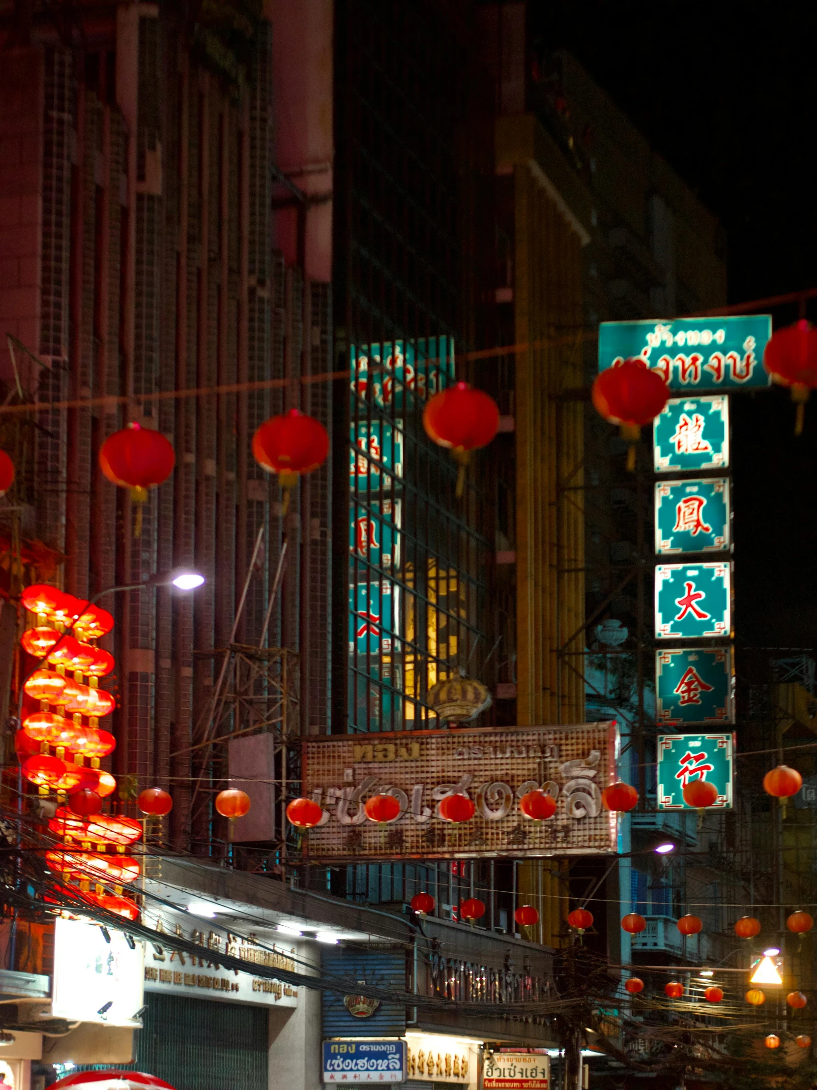 many lights that are on buildings near one another