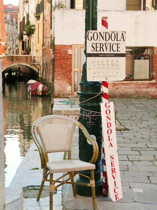 a chair is next to a water main sign