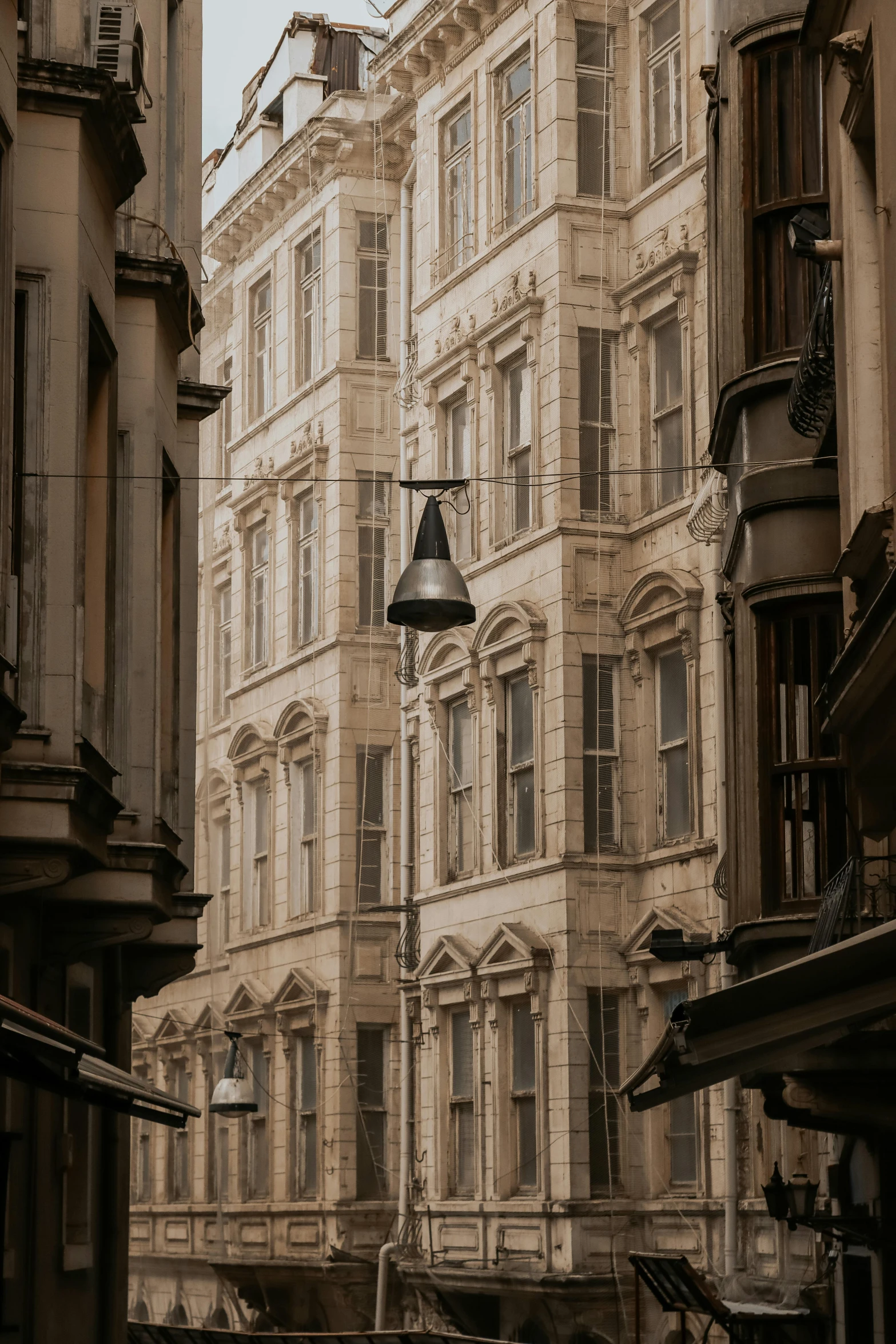 an old looking building with a clock on the outside