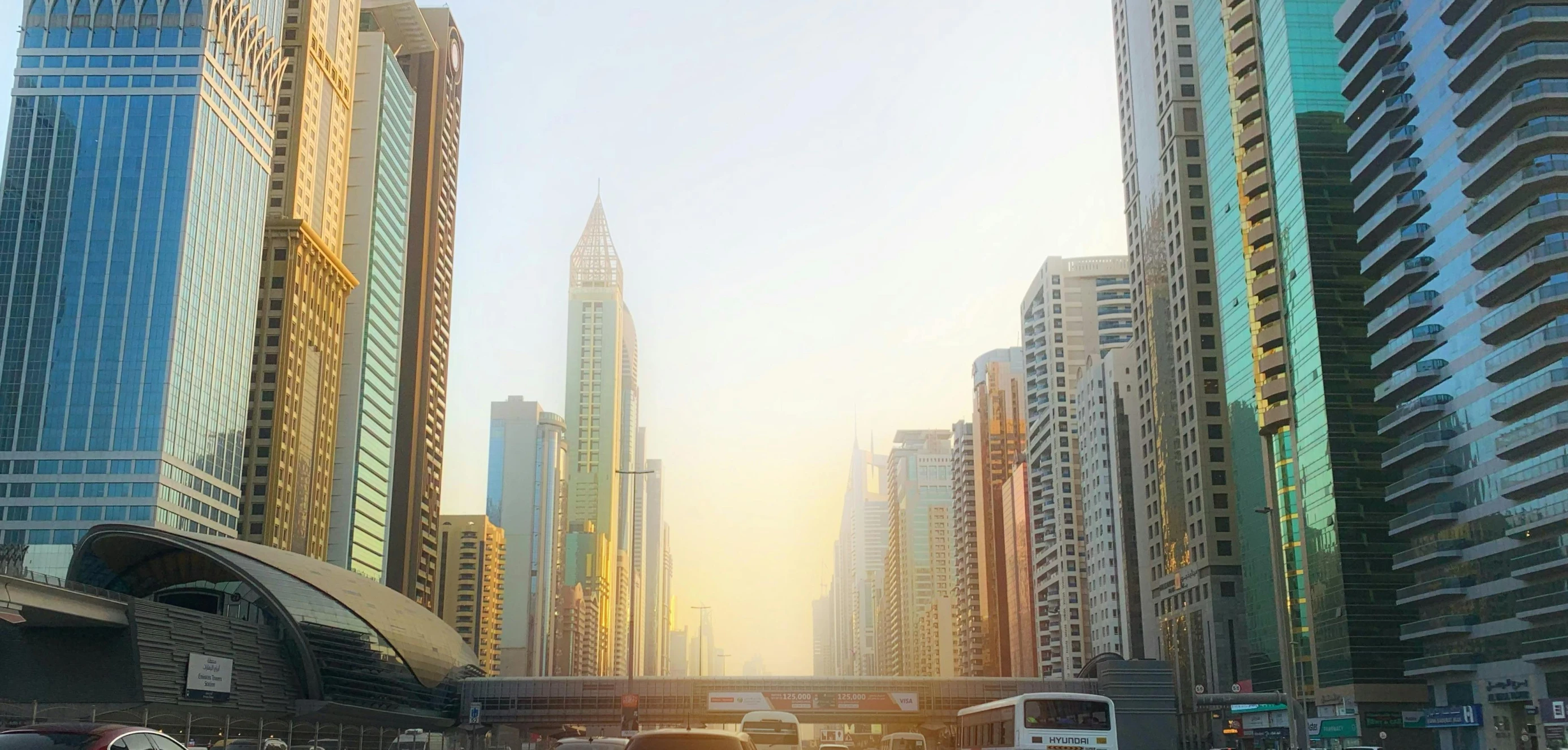 a busy city street and lots of tall buildings