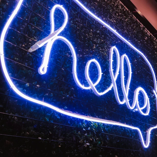 a blue ball logo on the side of a wall