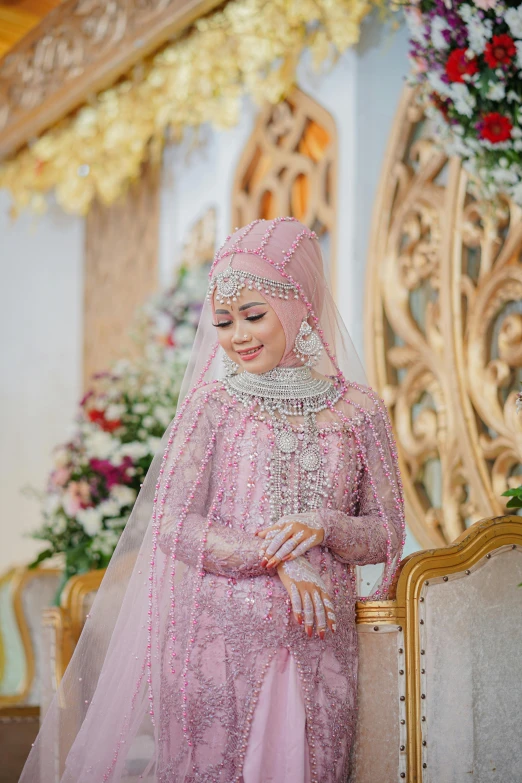 a woman dressed in a wedding outfit smiles