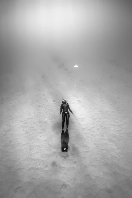 a person with skis on the snowy ground
