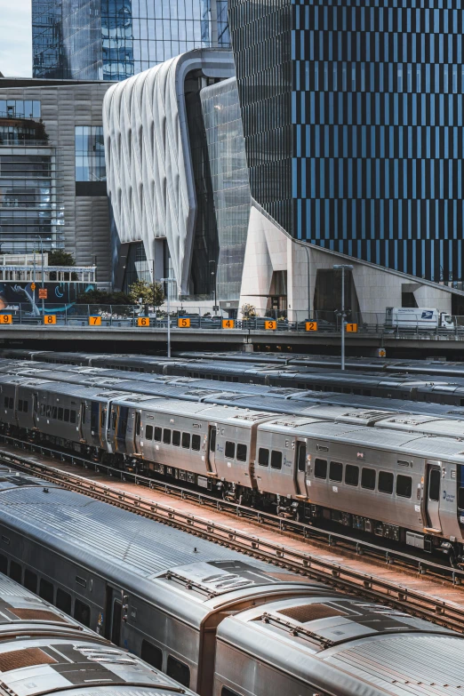 a subway train in front of a large building