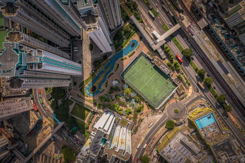 an aerial view of a tennis court and a train yard