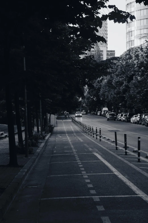 the road is empty as it winds across a city street