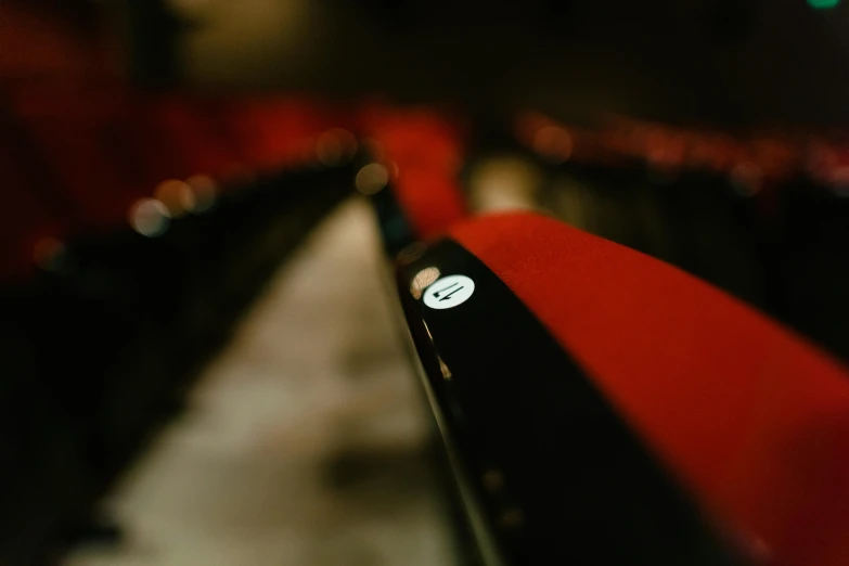 a view of an audience looking down on red seats