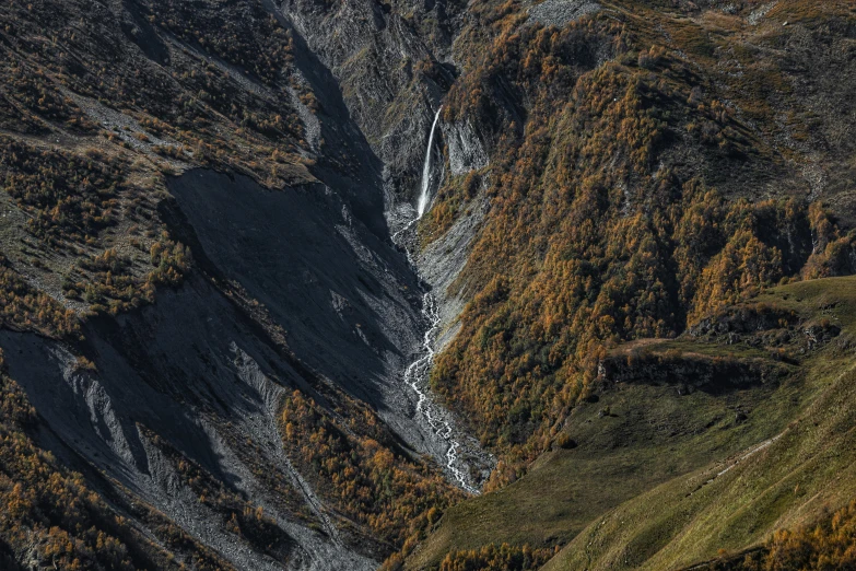 a mountain with large canyon that leads to another one