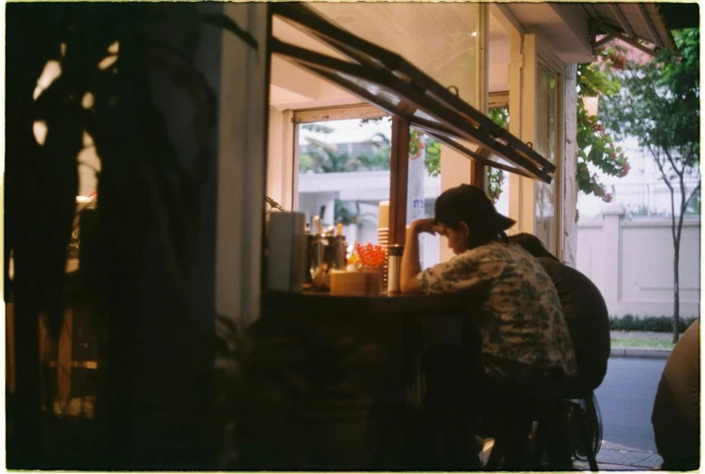 a woman is standing in front of the counter