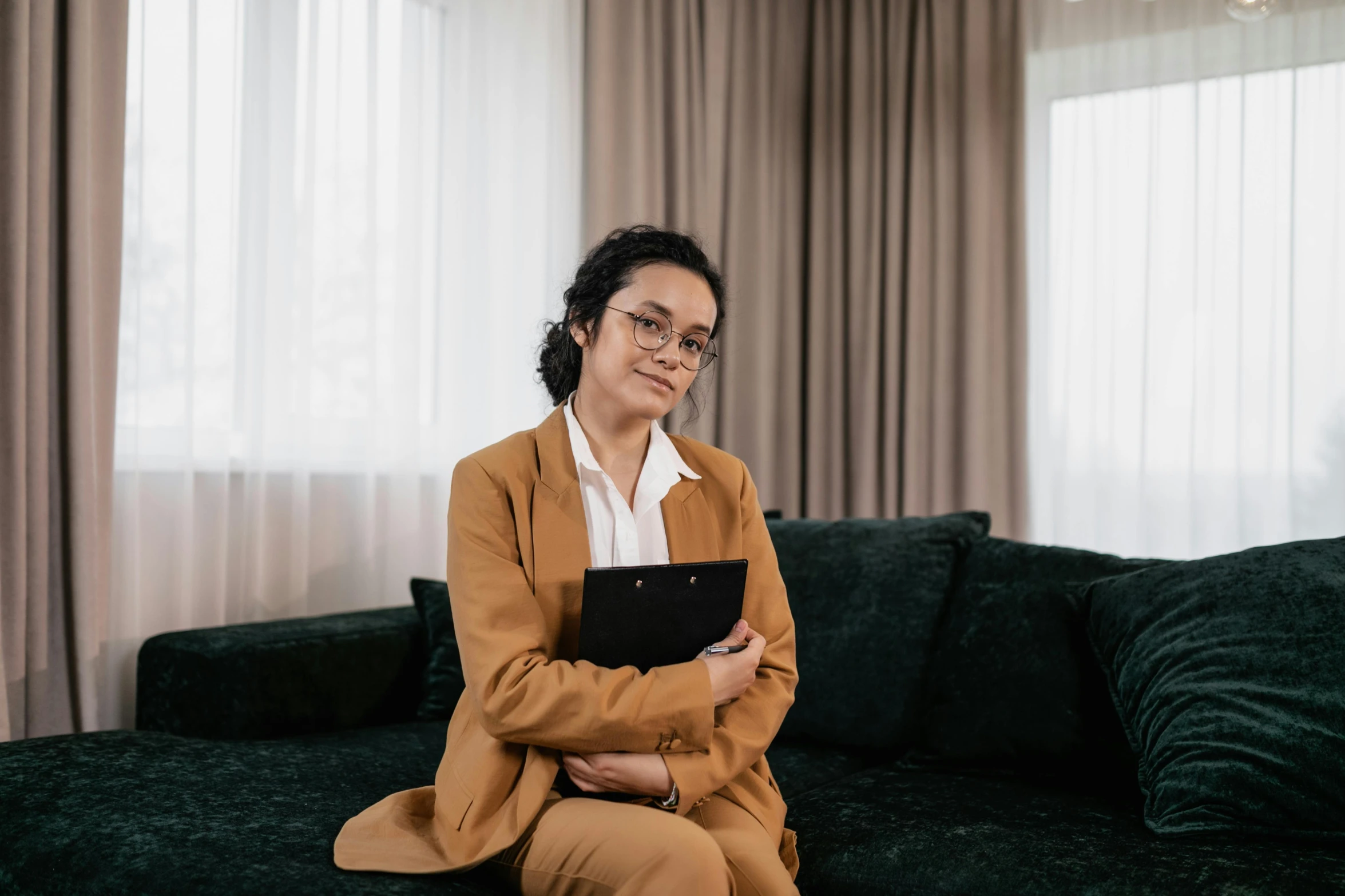 a person sitting on a couch in a living room