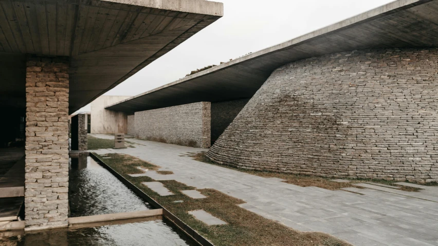 a long stretch of paved walkway beside a building