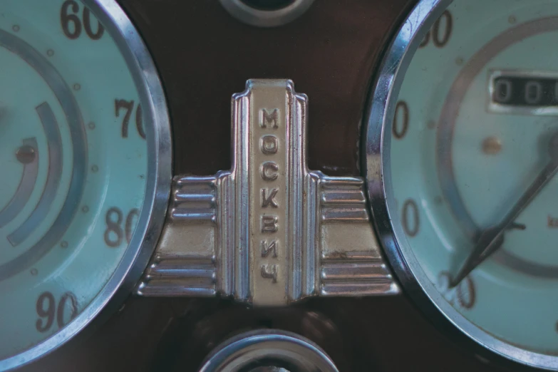 two gauges, three and one are numbered in silver