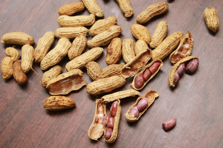 peanuts that have been broken and open on a table