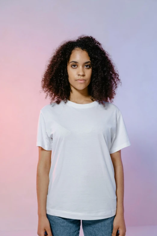 a woman standing up and wearing a white shirt