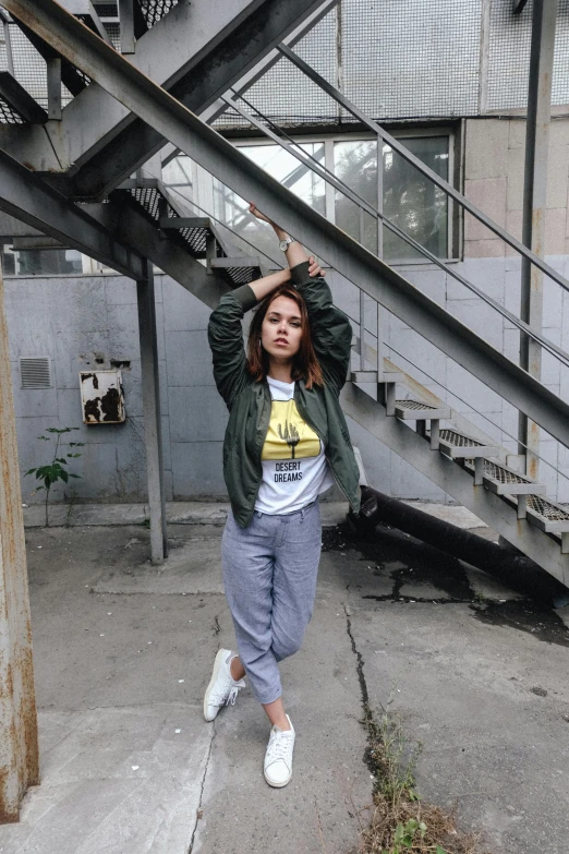 a woman poses for the camera while wearing a shirt with a cartoon on it