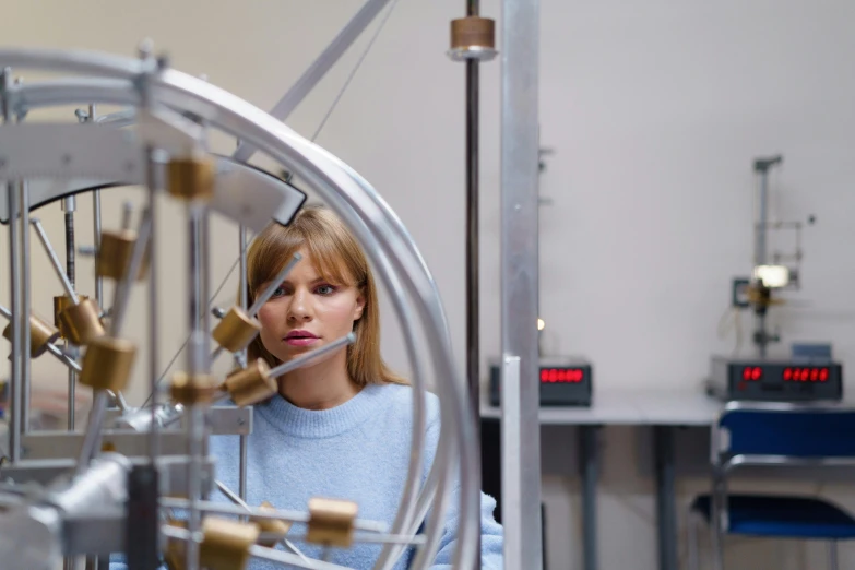 woman working in the machine room looking up