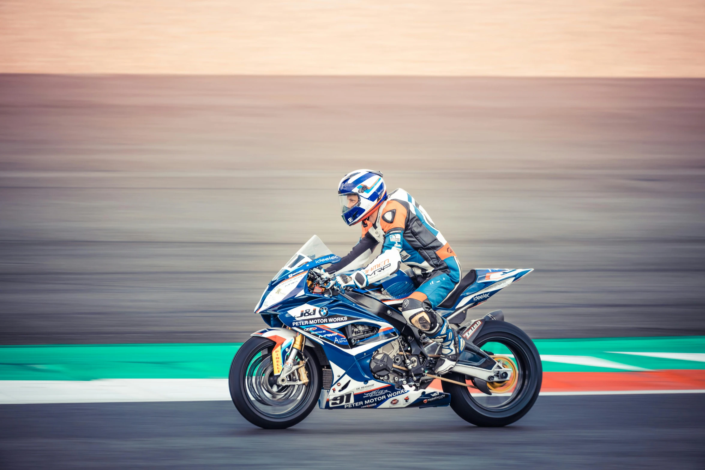 a person riding on a motorcycle on a race track