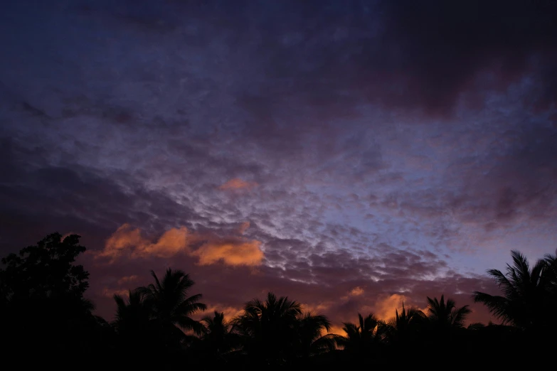 clouds are shown as sun sets in the sky