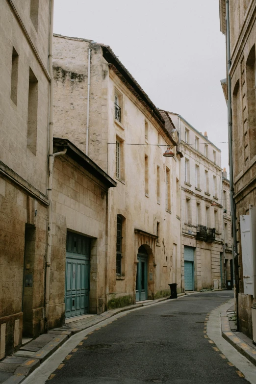 a city street with various doors and buildings