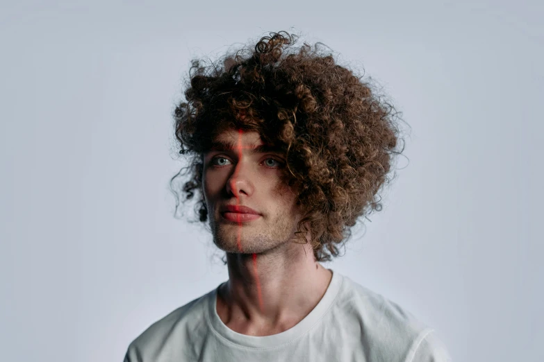 a man has his hair trimmed by someone