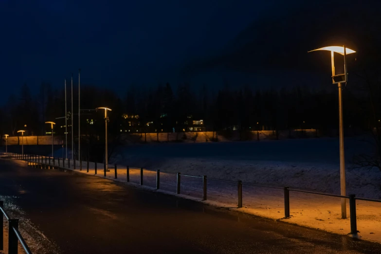 the path is lined with poles and lampposts