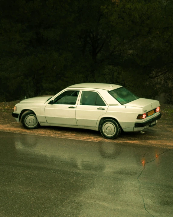 a white car parked on the side of the road