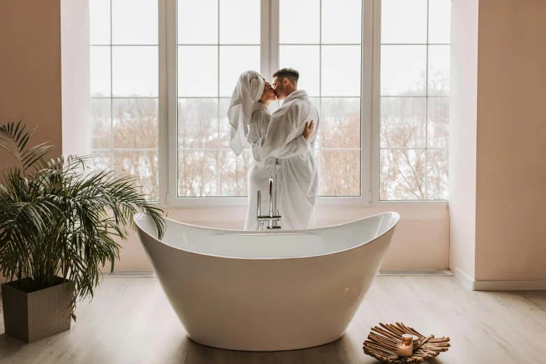 two people are in the middle of a bathtub