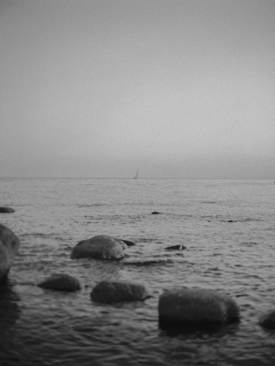 a black and white image of an ocean