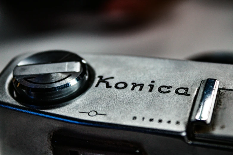 a chrome colored camera with konicca written on it