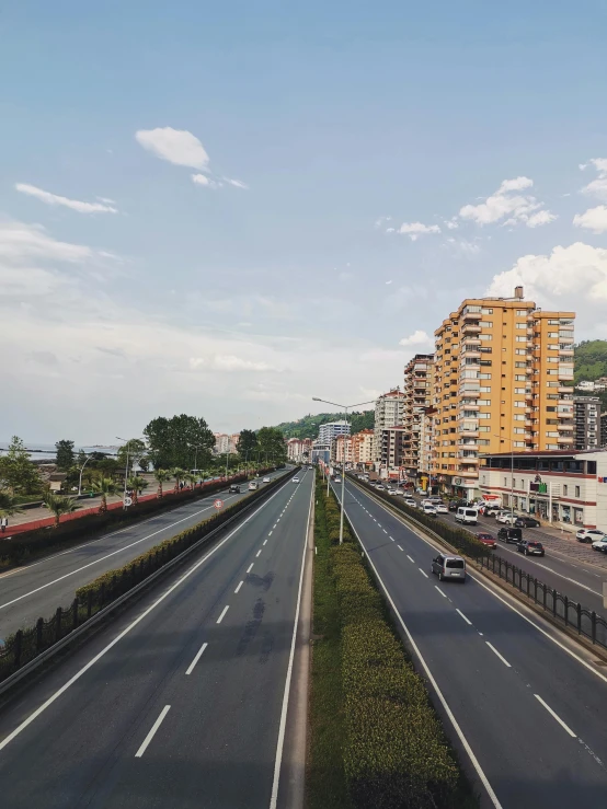 a road near the city and tall buildings