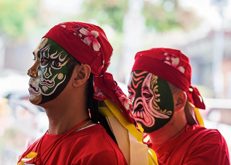 two men are wearing masks on their faces