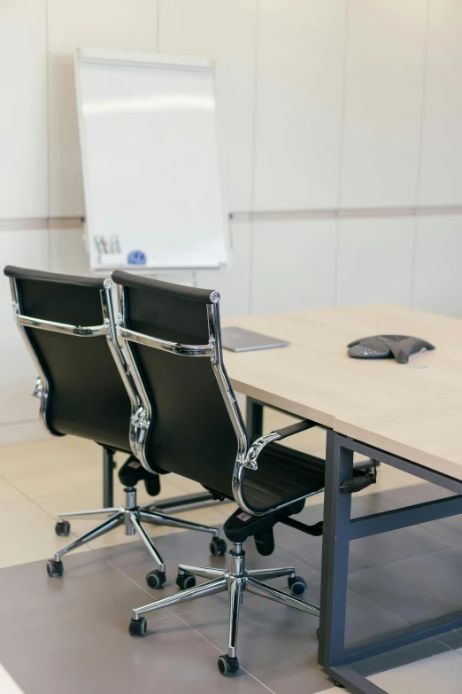 two chairs are on the floor at an office