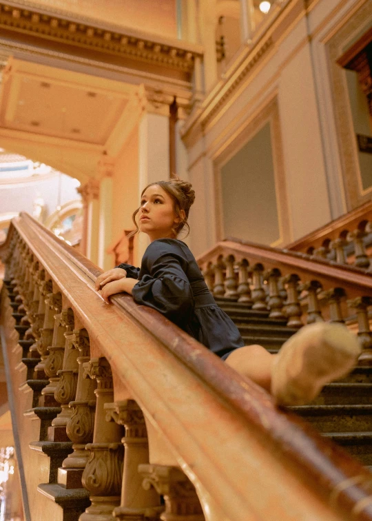 woman on balcony of a building, in the foreground