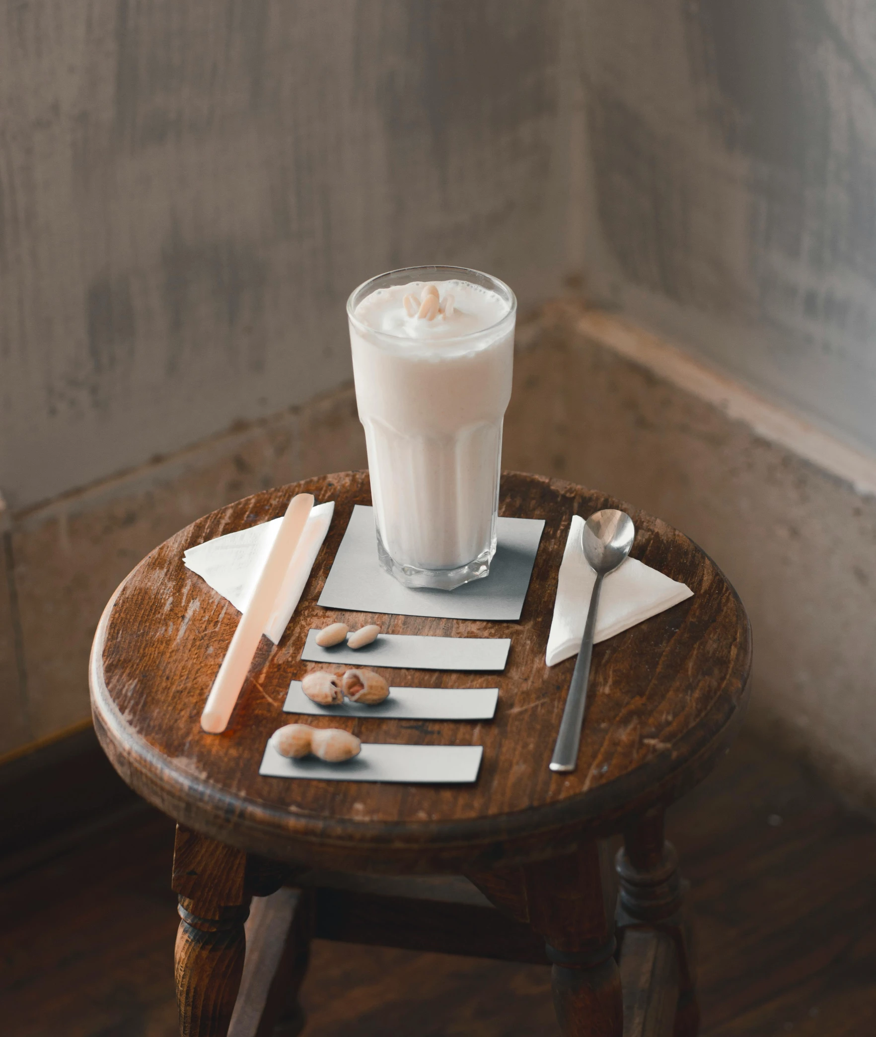 an arrangement of food including utensils is served on a small table