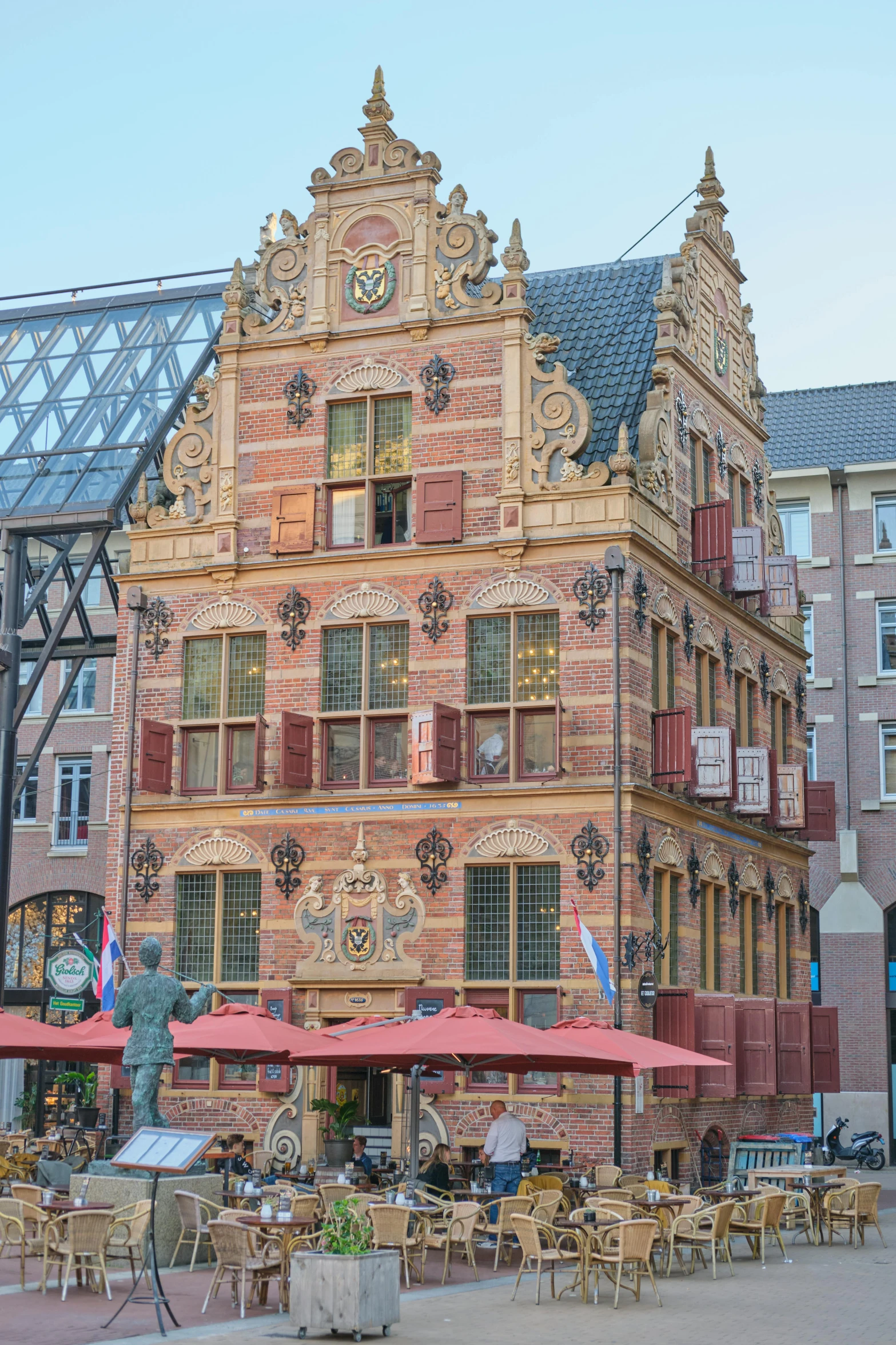 the courtyard in front of a building has tables and chairs