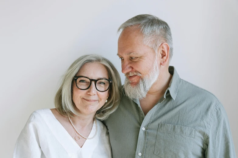 an older couple smiles for their portrait