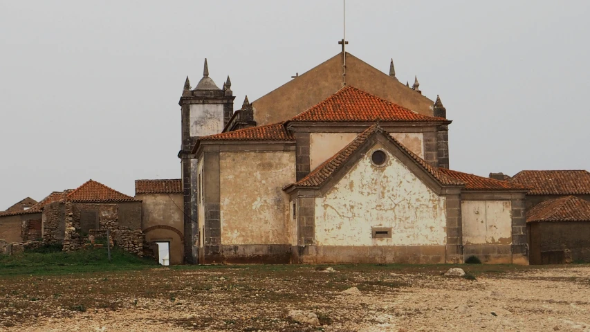 this is an old church on the corner of a road