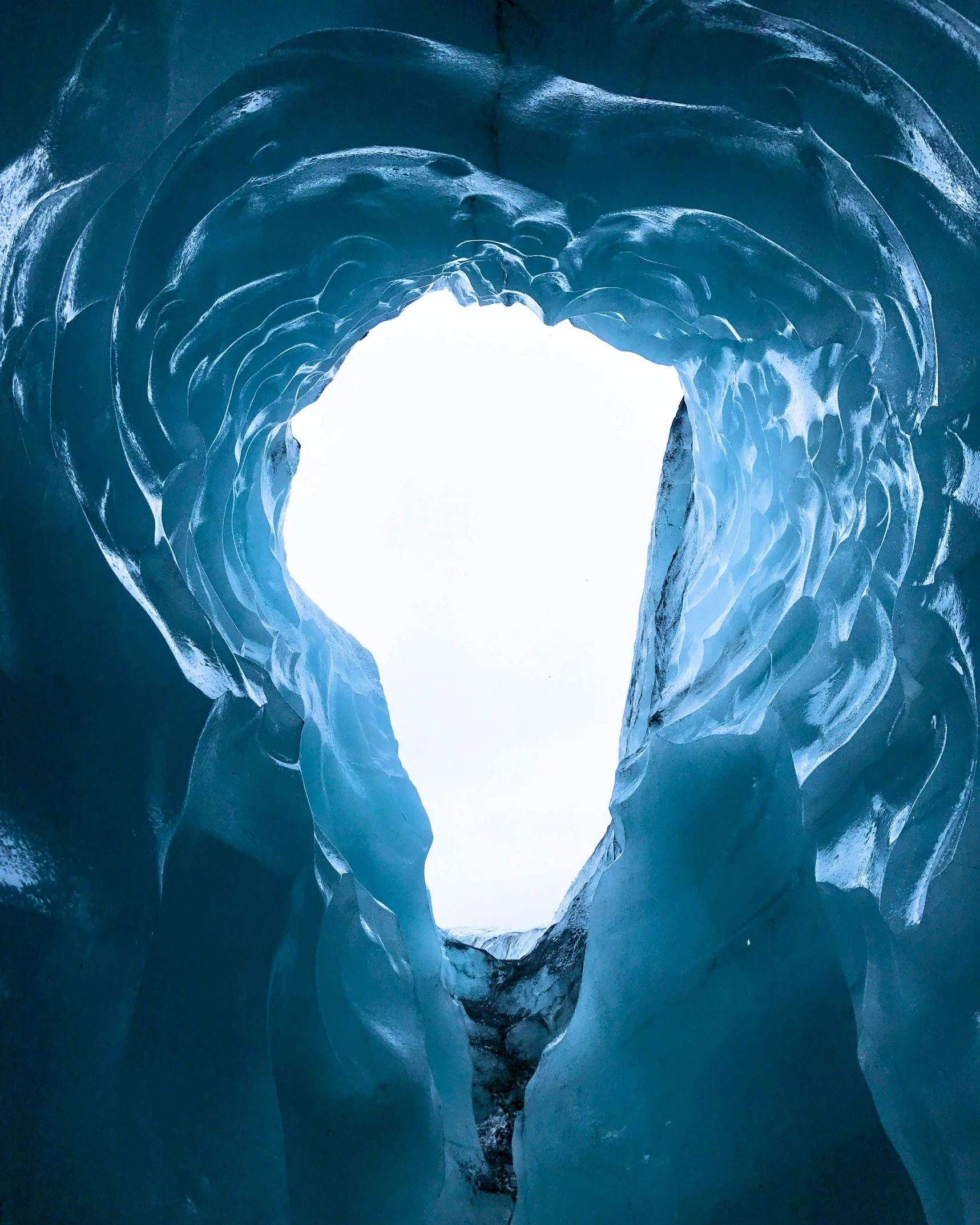 the inside of a massive ice cave that is frozen