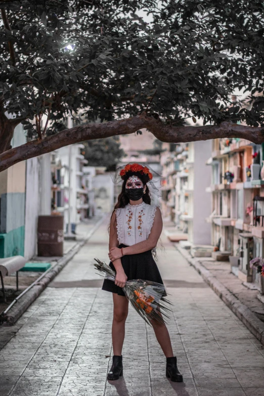 a woman in a pirate costume standing on a sidewalk