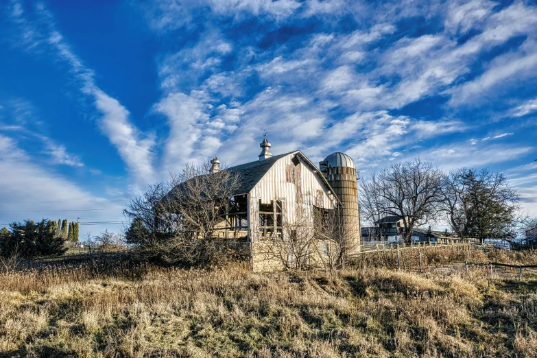 a old building in an old field during the day