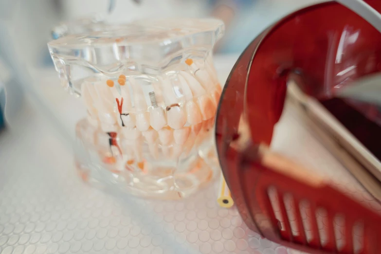 a glass item is sitting next to a container