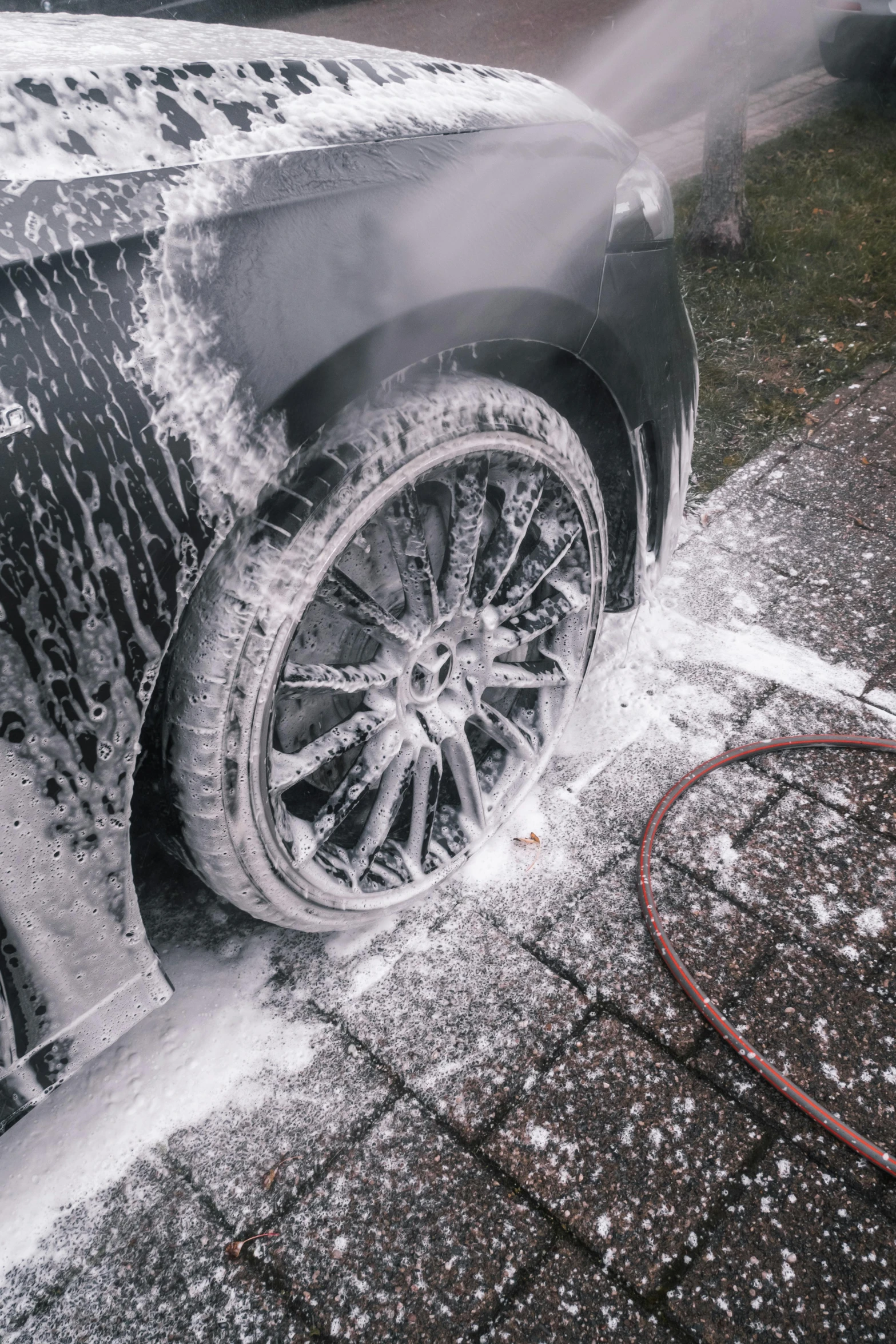 the car is being washed with water and spray