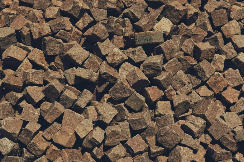 rocks scattered together and brown and black
