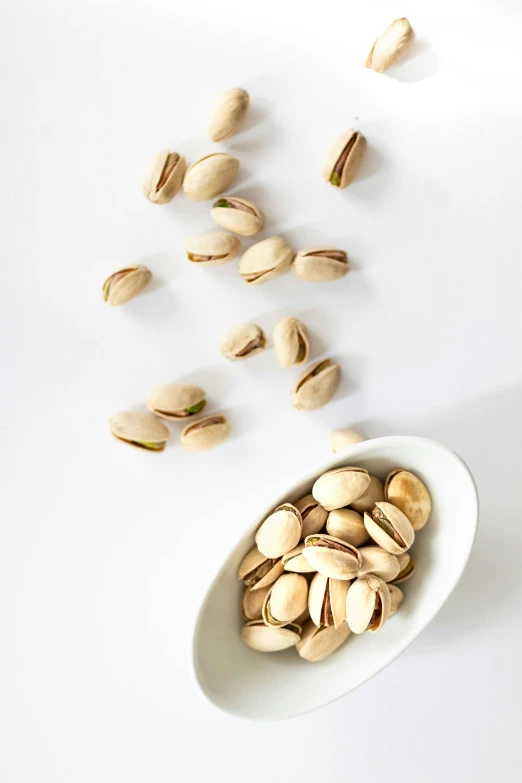 two white spoons of raw cashew seeds